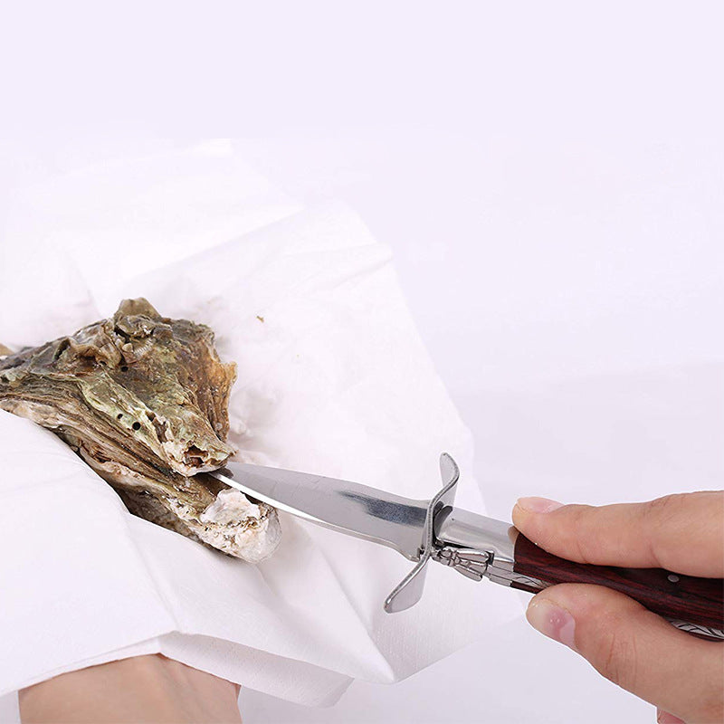 Stainless steel oyster knife with cut resistant gloves